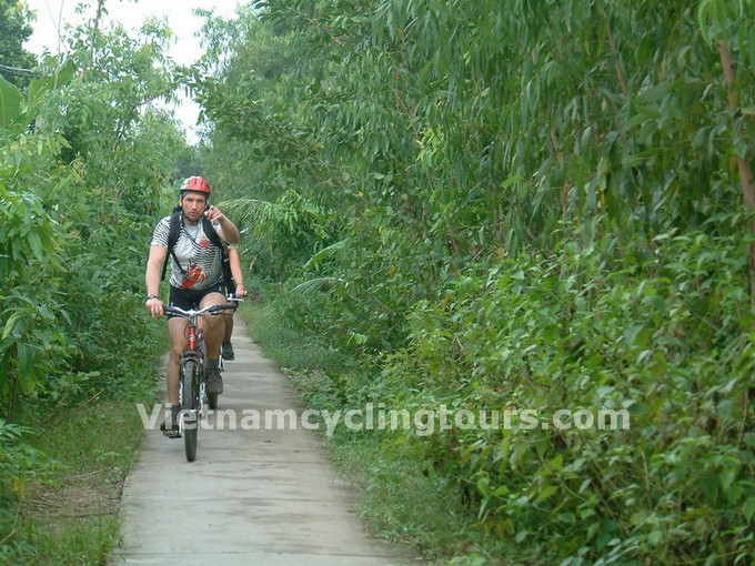 Biking Caibe's countryside, enjoy lunch at local home, before crossing Mekong River by local ferries